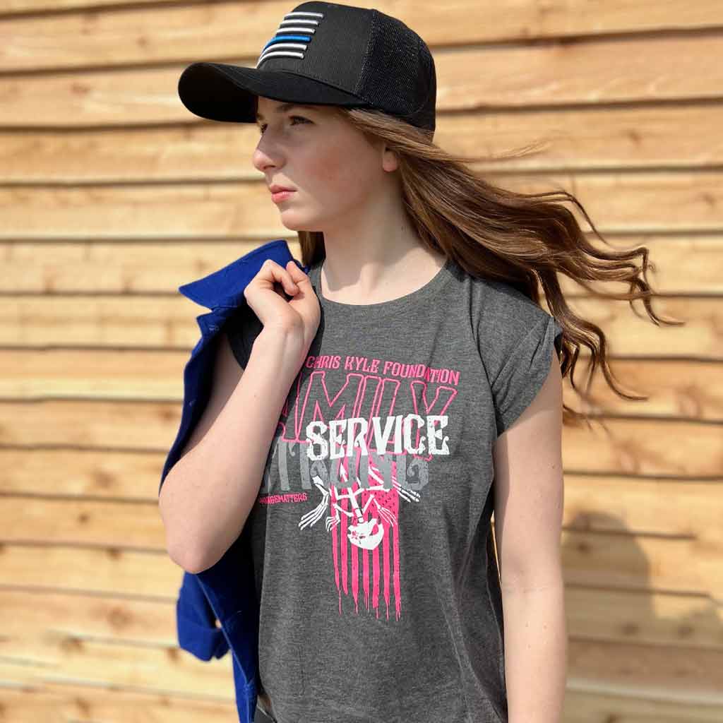 Family service strong pink graphic shirt on model